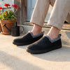 Eliu Slippers in Black, worn at home